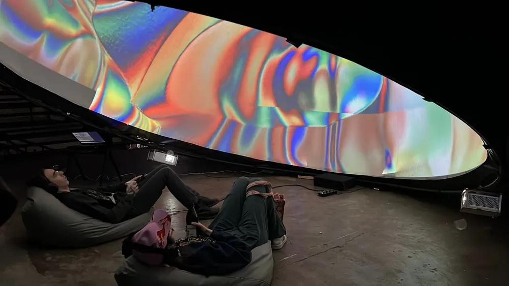 A dome screen projection above the audience